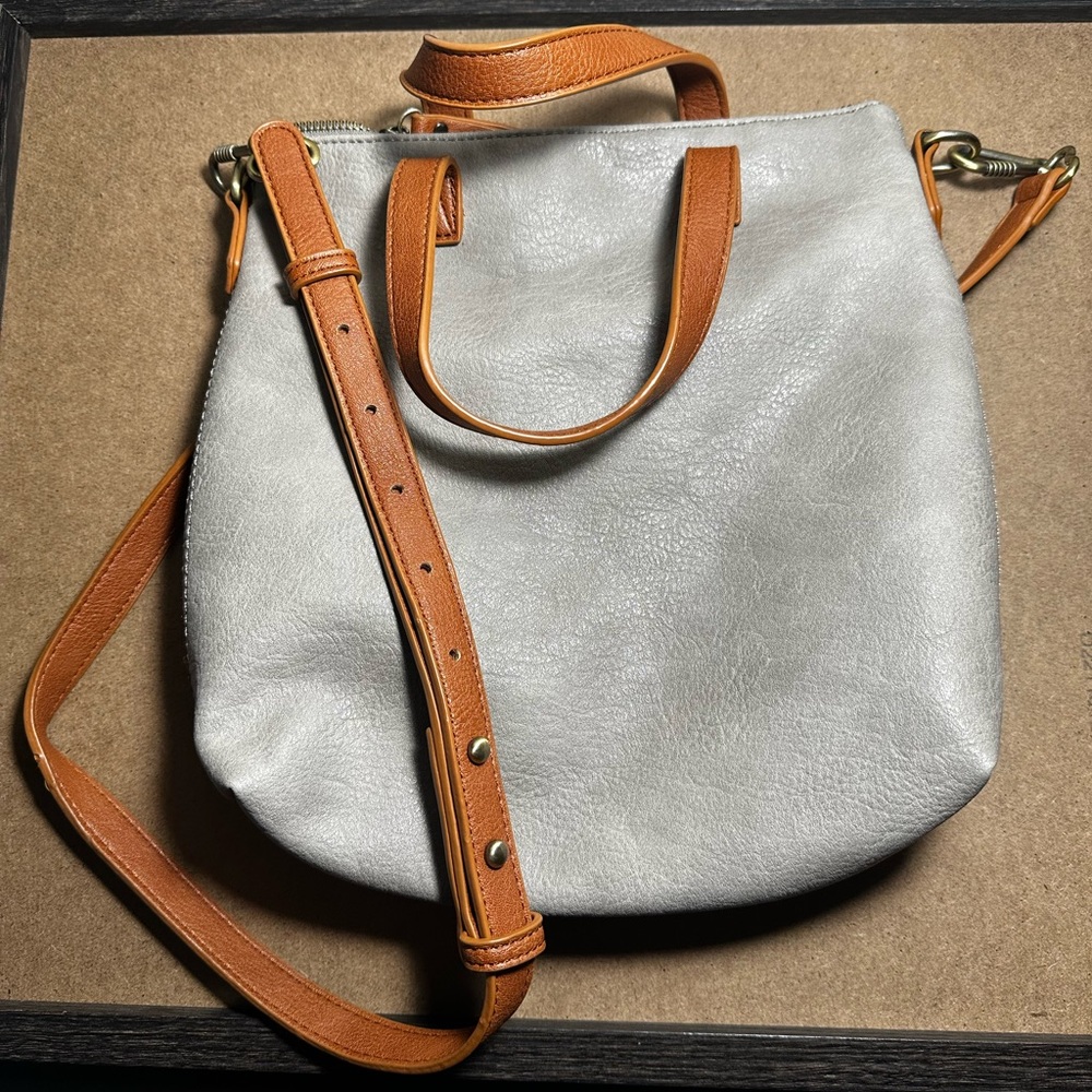 Tan/grey and brown crossbody purse.